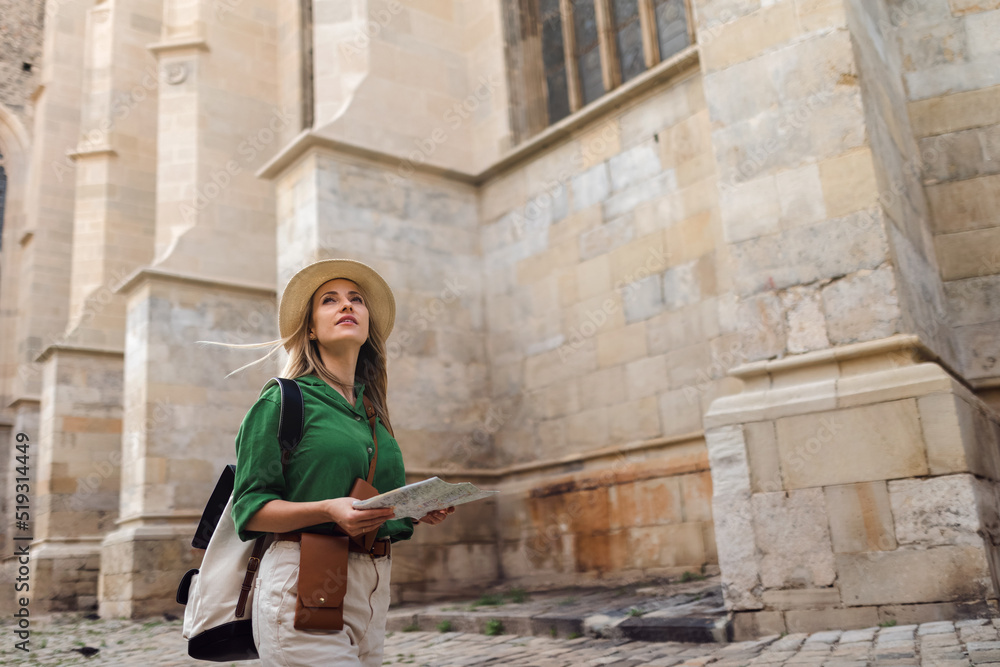 Young woman travel alone in old city centre. Young woman travel alone in old city centre.