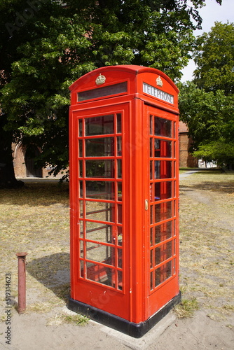 Red telephone box, a telephone kiosk for a public telephone. Salzwedel, Saxony-Anhalt, Germany. © guentermanaus