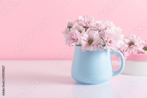 Pink flowers in blue cup against  pink wall. Valentine's Day, Happy Woman's Day, Mother's Day, Birthday, Wedding © prime1001
