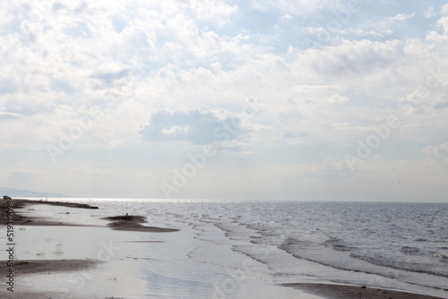 Sandy beach with blue sea and blue sky and white cloud is beautiful on the coast. beautiful blue ocean shore outdoor nature landscape water background.