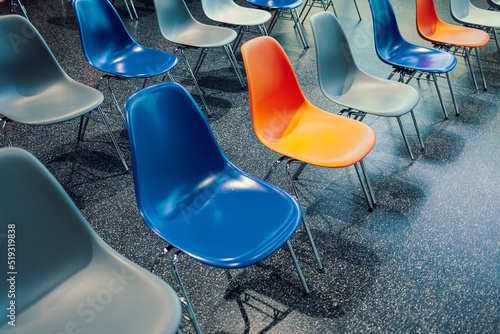 blue and orange chairs in a row