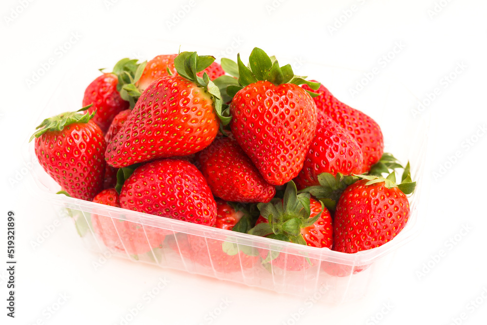 fresh appetizing strawberries in a plastic tray onwhite background fresh appetizing strawberries in a plastic tray onwhite background