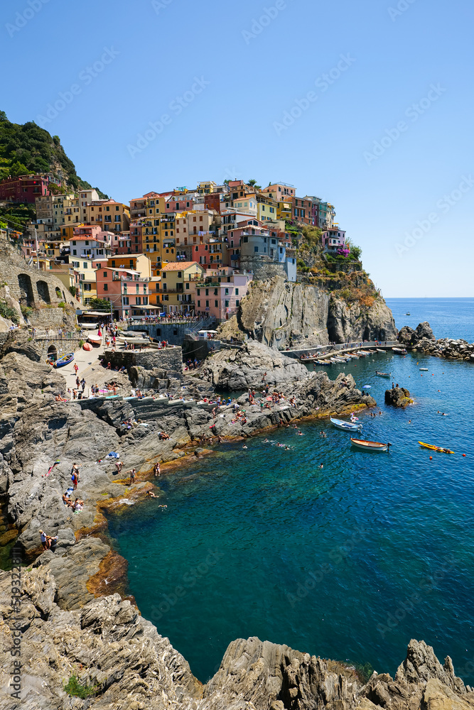Travel to Cinque Terre (English Five Lands). Aerial view over Manarola architecture landmark village at the coast of Liguria Sea from Italy. 