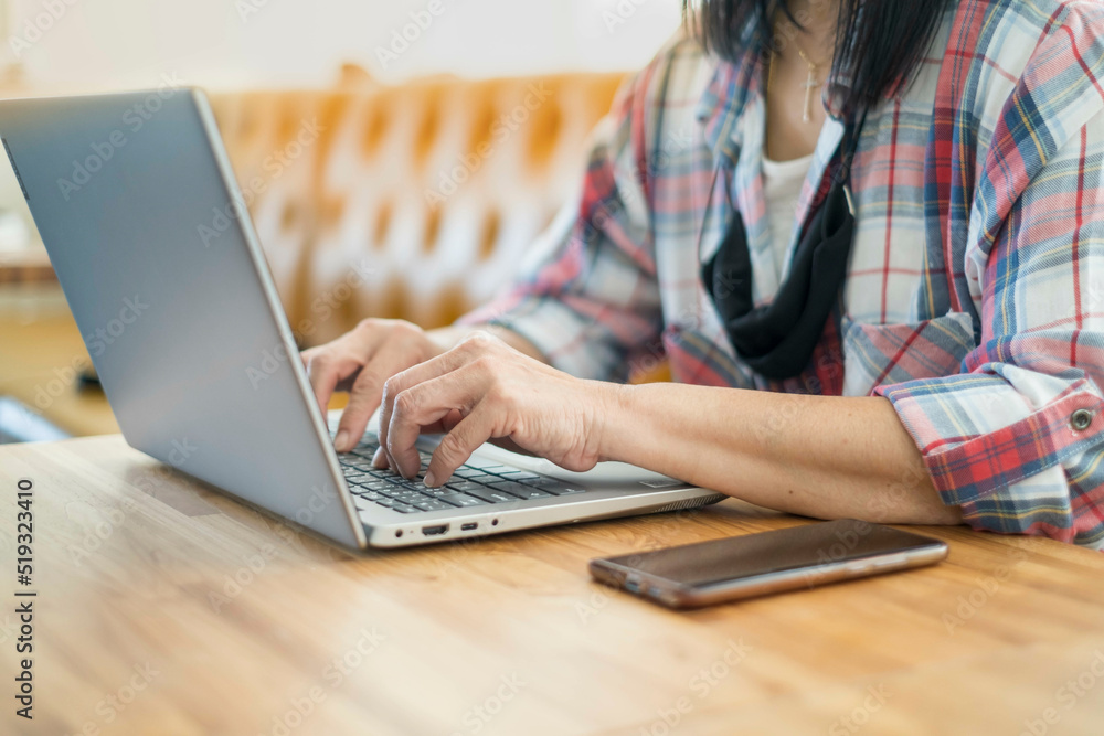 Woman business lifestyle working laptop office modern. shopping online for payment in notebook. female writer keyboarding happy cheerful pleased. girl freelance working at a coffee shop. out of focus Woman business lifestyle working laptop office modern. shopping online for payment in notebook. female writer keyboarding happy cheerful pleased. girl freelance working at a coffee shop. out of focus