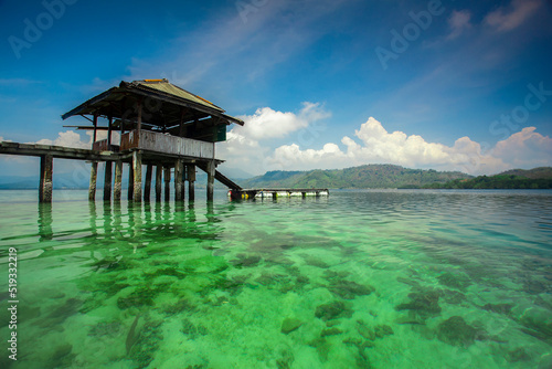 building on a clear sea under a blue sky. Indonesian landscapes tropical beaches.