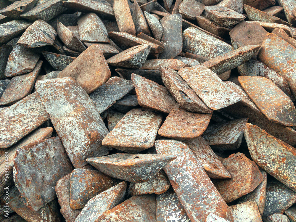 Ingots of cast iron stored in the warehouse. The form of cast iron