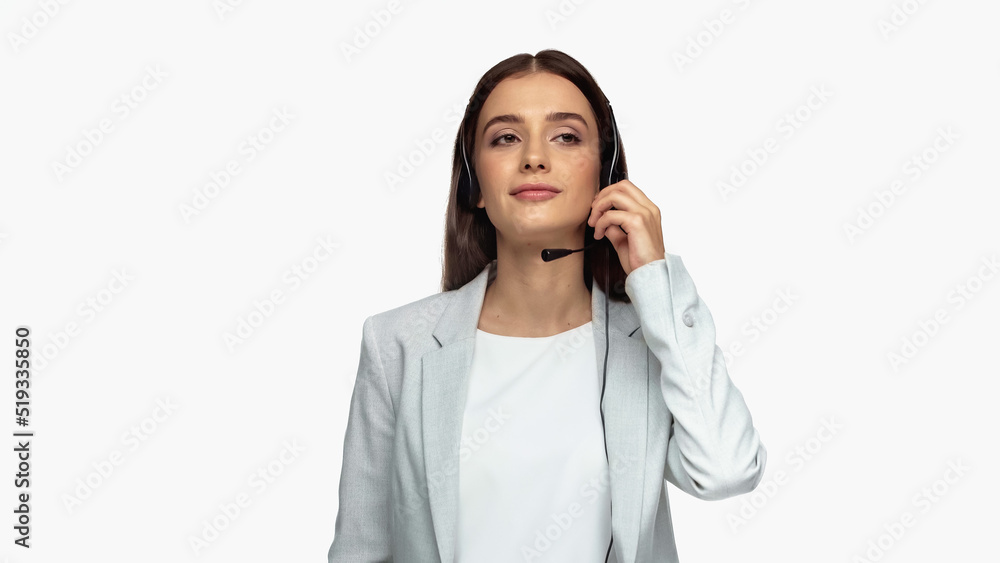 young operator in headset with microphone and grey blazer isolated on white. young operator in headset with microphone and grey blazer isolated on white.