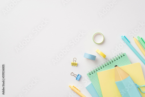 Back to school concept. Top view photo of school accessories pencil-case notepads pens binder clips and adhesive tape on isolated white background with copyspace