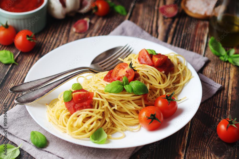 Italian pasta spaghetti with basil and cherry tomatoes Italian pasta spaghetti with basil and cherry tomatoes
