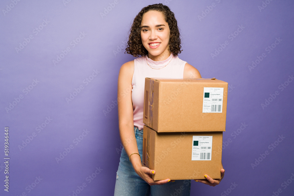Beautiful caucasian woman receiving a lot of mail packages Beautiful caucasian woman receiving a lot of mail packages