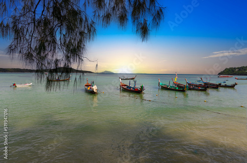 Wallpaper Mural Colourful Skies Sunset over Rawai Beach in Phuket island Thailand. Lovely turquoise blue waters, lush green mountains colourful skies and beautiful views of Pa Tong Patong Torontodigital.ca