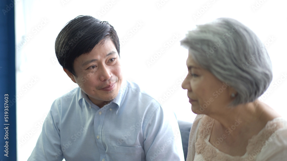 Asian senior man talking to elder woman with empathy. Asian senior man talking to elder woman with empathy.