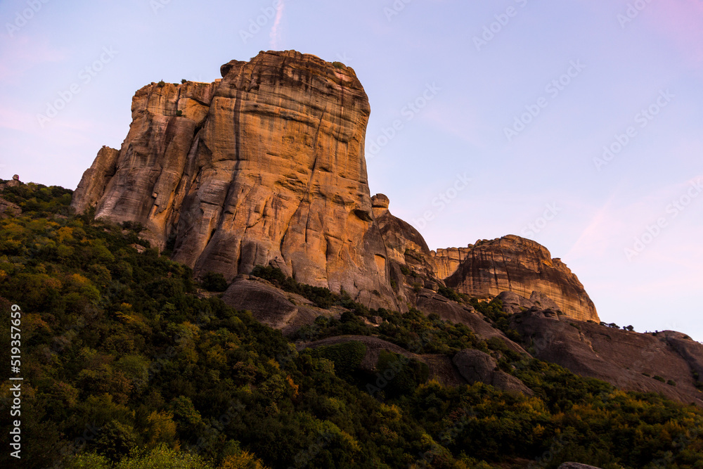 The conglomerate formation of Meteora during sunset, beside the Pindos Mountains. Central Greece