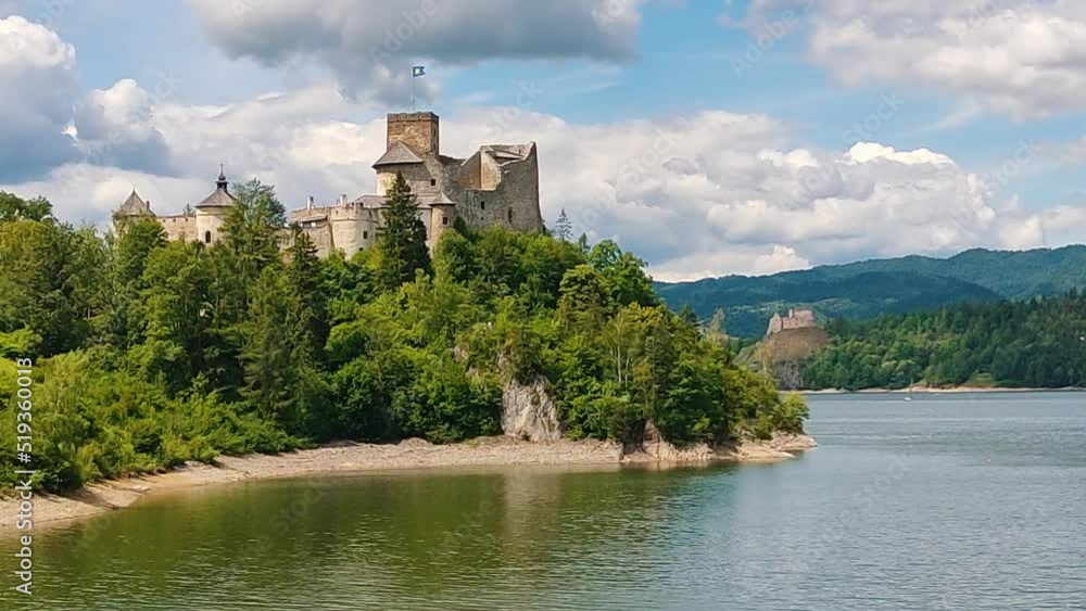 Niedzica Castle Also Known as Dunajec Castle by Lake Czorsztynin the Pieniny Mountains, Poland. And Tourist Ferrys in the Lake. Summer Day With Fast Moving Clouds. Czorsztyn Castle at the Background Niedzica Castle Also Known as Dunajec Castle by Lake Czorsztynin the Pieniny Mountains, Poland. And Tourist Ferrys in the Lake. Summer Day With Fast Moving Clouds. Czorsztyn Castle at the Background