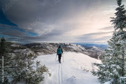 Active woman, hiking the Dome mountain on a winter day, Charlevoix region, QC, Canada © David