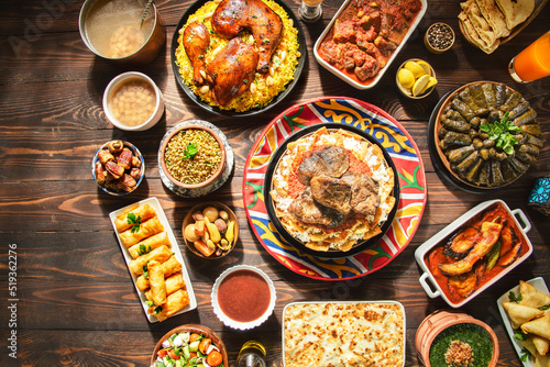 Arabic Cuisine: Middle Eastern traditional lunch. It;s also Ramadan "Iftar" . The Meal eaten by Muslims after sunset during Ramadan. Assorted of Egyptian oriental dishes. Top view with copy space.