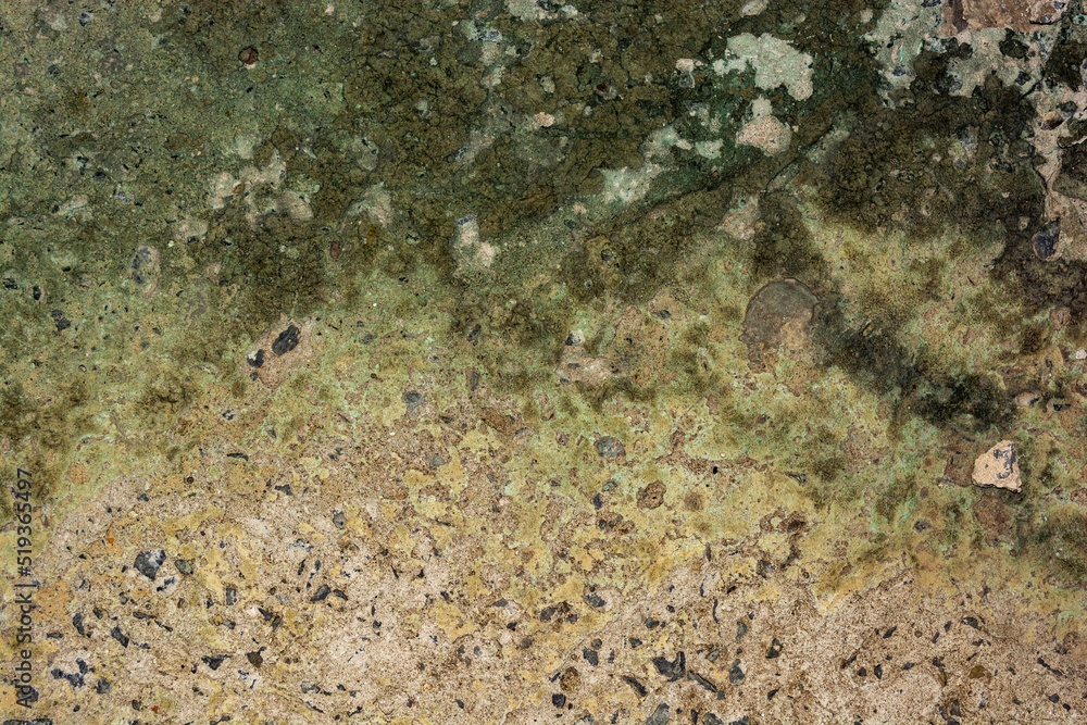 Old cracked concrete with a green tint with traces of copper oxide Old cracked concrete with a green tint with traces of copper oxide