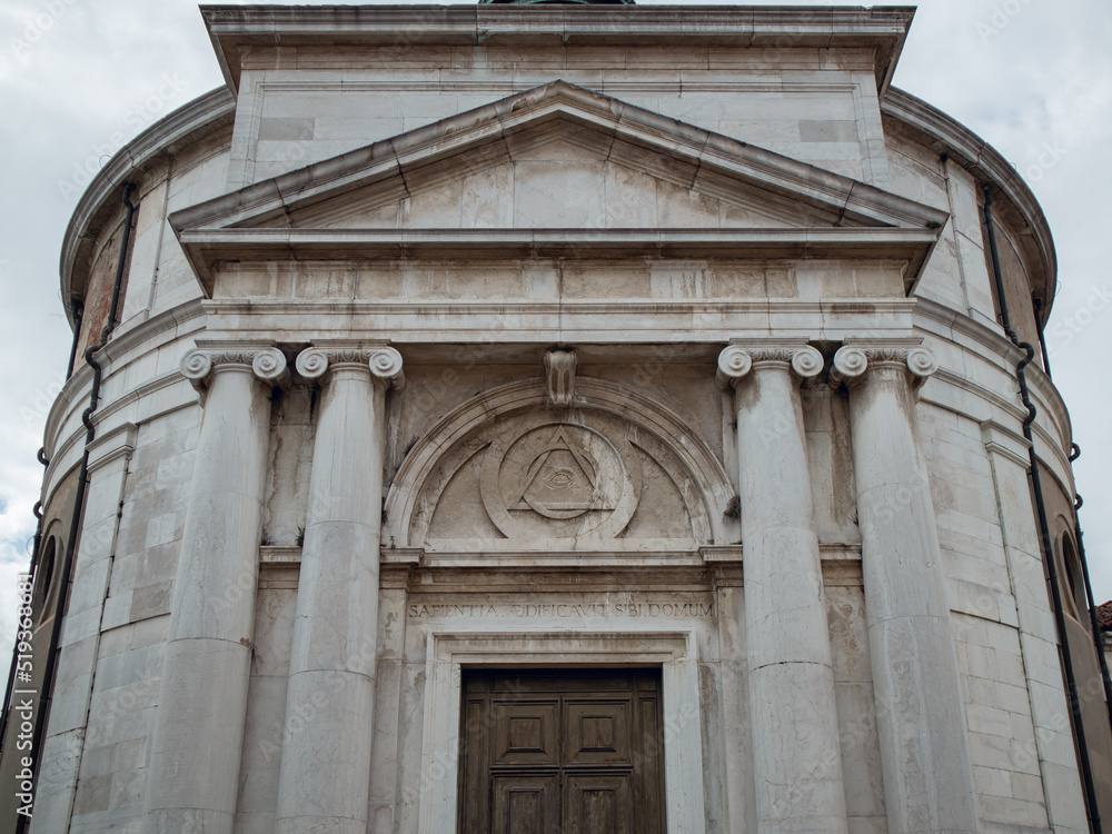 Venetian cathedral with columns and large wooden doors