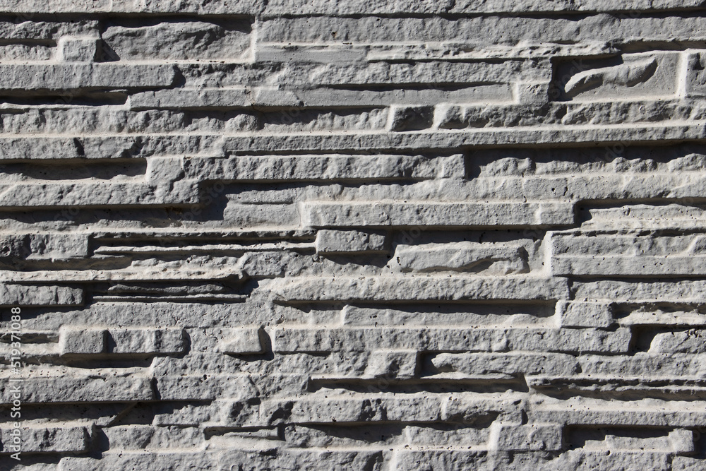 Naklejka premium White narrow stone wall background texture