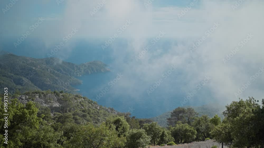 view from a high mountain to the rocky steep coast of the Aegean Sea in Turkey. Summer vacation and travel in Turkey. view from a high mountain to the rocky steep coast of the Aegean Sea in Turkey. Summer vacation and travel in Turkey.