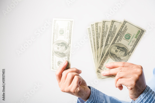 Close up of woman hand holding 100 dollar bills. success business female happy with many money banknote. Finance and economics concepts.