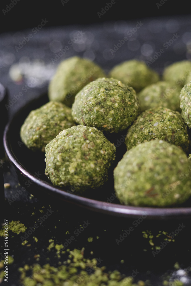 Fototapeta premium Ingredients to make falafel. Grounded chick peas. Green healthy food. Vegan delicious dish. Vegetarian meal. Food preparation. Arabic dish.