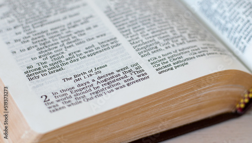 Canvas-taulu The birth of Jesus Christ, biblical verses in an open Holy Bible Book with golden pages