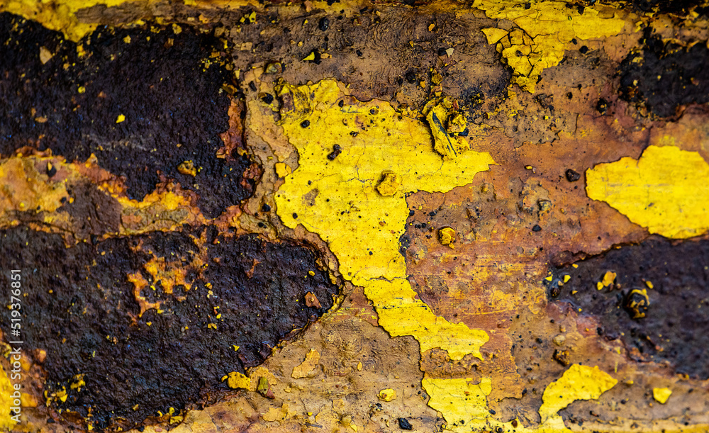 Abstract rusty metal texture in aged yellow paint closeup Abstract rusty metal texture in aged yellow paint closeup