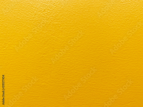 Seamless texture of yellow cement old wall a rough surface, with space for text, for a background..