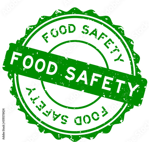Grunge green food safety word round rubber seal stamp on white background