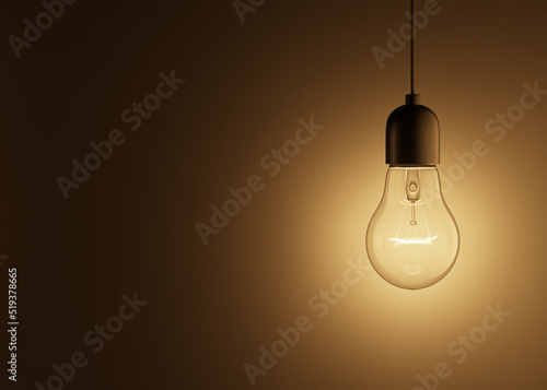 3d rendering of a glowing light bulb hanging on a wire on a black background