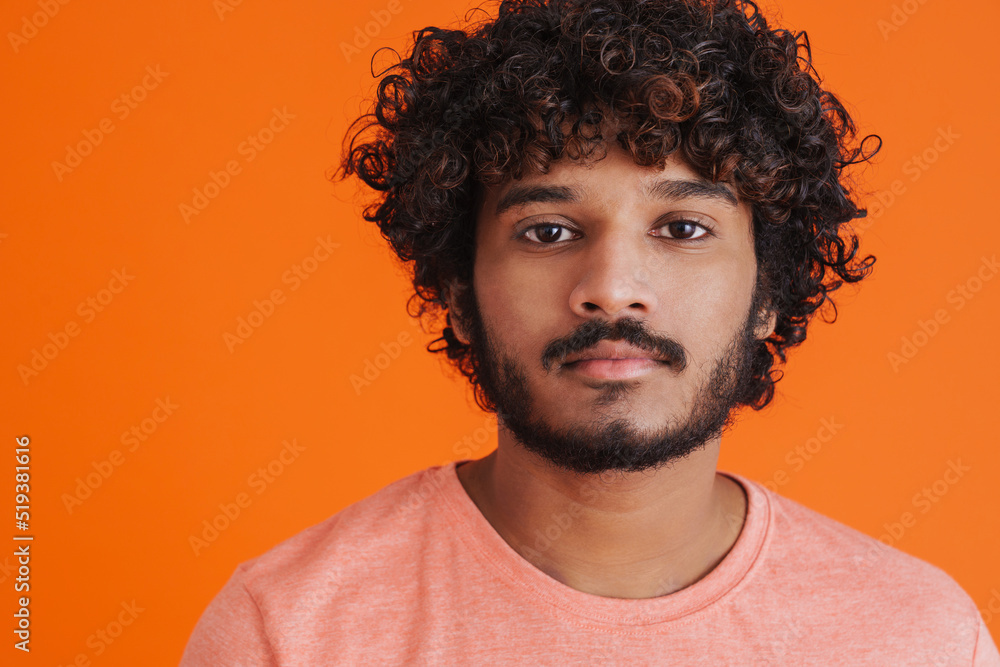 Portrait of young indian handsome curly calm man Portrait of young indian handsome curly calm man