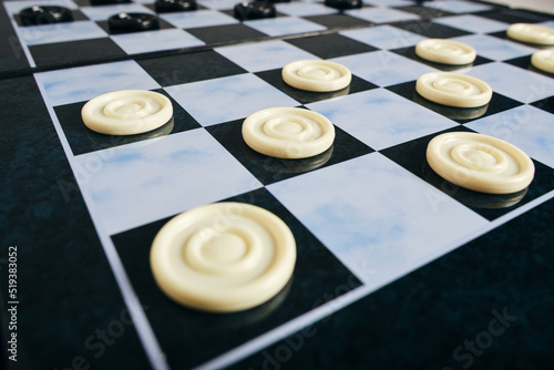 Background, checkers board with checkers, checkers is logical game for two.