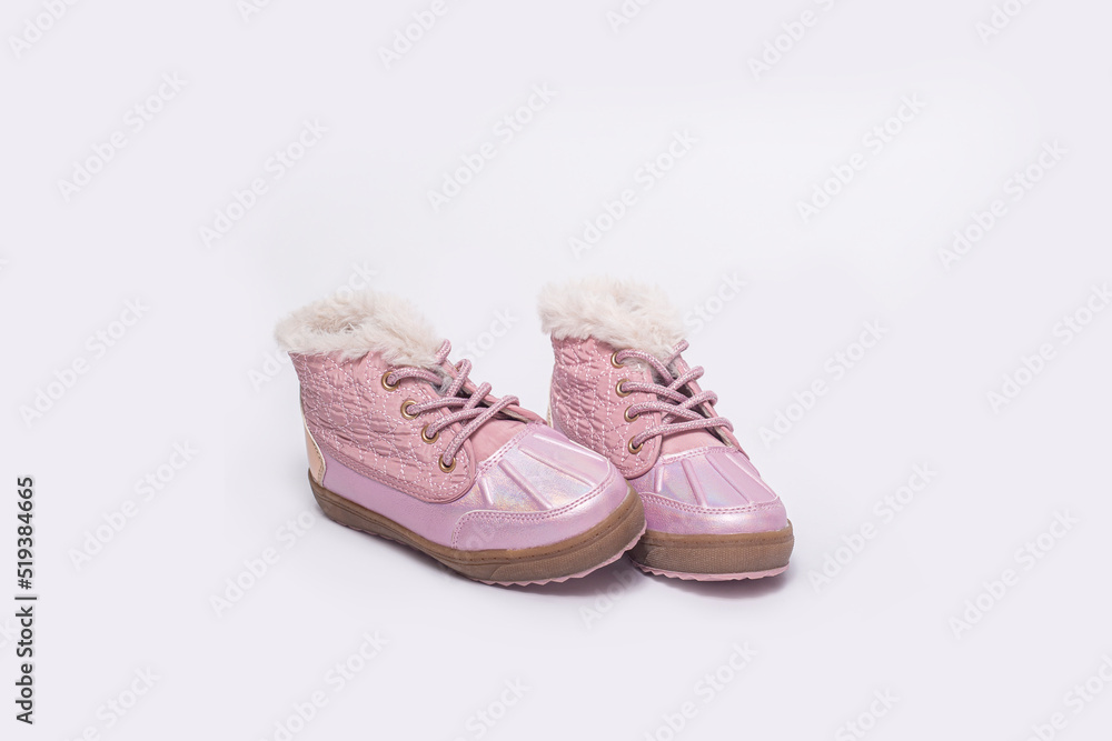 Fashionable children's boots for a girl on a white background. Fashionable children's boots for a girl on a white background.