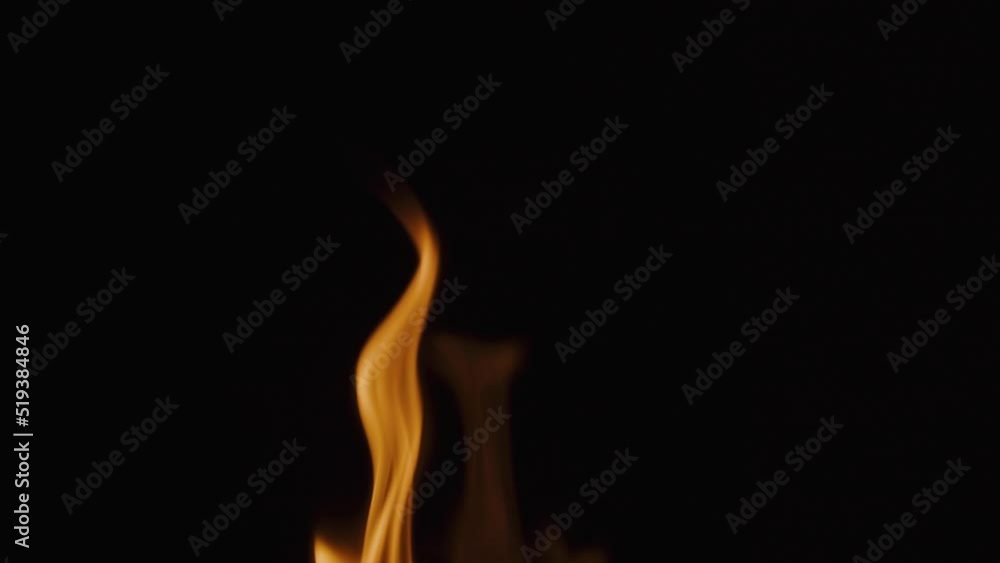 Fire flame texture close-up. Burning on black background. Fire flame texture close-up. Burning on black background.