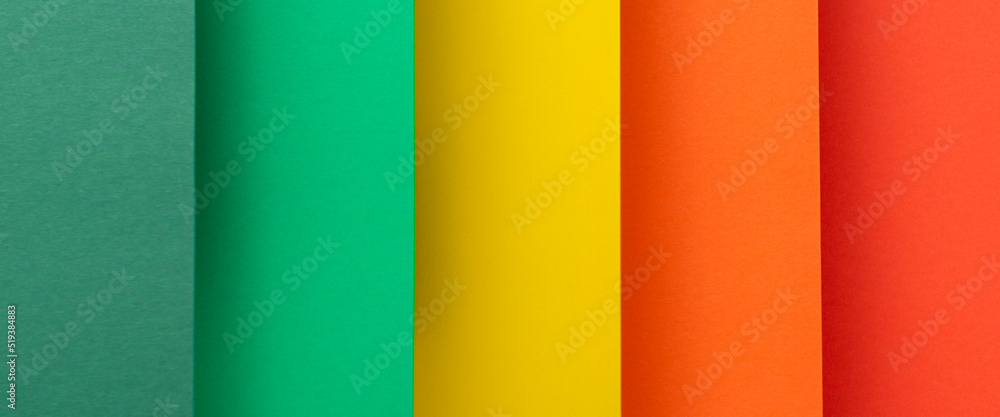 Colored background vertical from folded paper material. Top view, flat lay. Banner Colored background vertical from folded paper material. Top view, flat lay. Banner