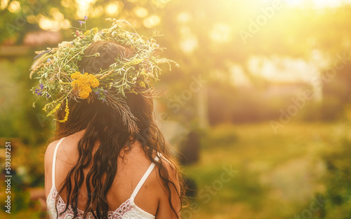 Canvastavla Woman in flower wreath on sunny meadow, Floral crown, symbol of summer solstice