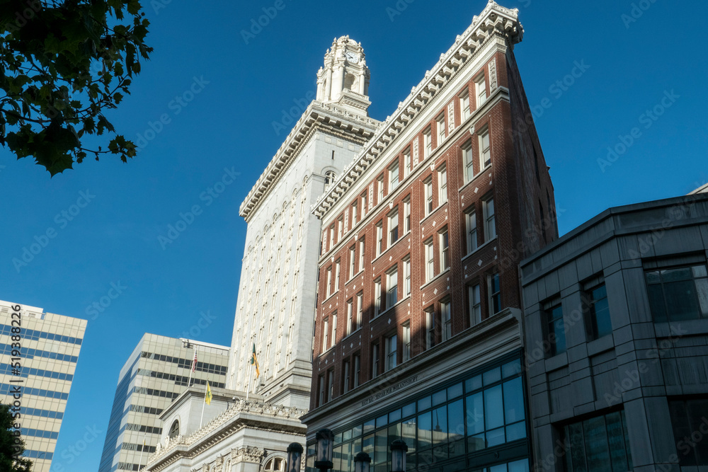 morning sun rises on the iconic city hall in Downtown Oakland