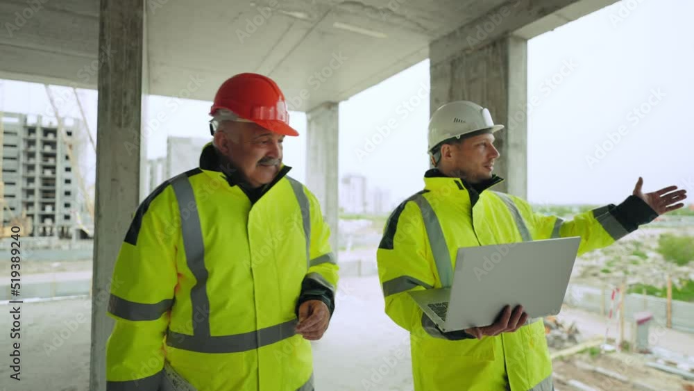 civil engineer and architect with laptop are examining under-construction building, building inspection civil engineer and architect with laptop are examining under-construction building, building inspection