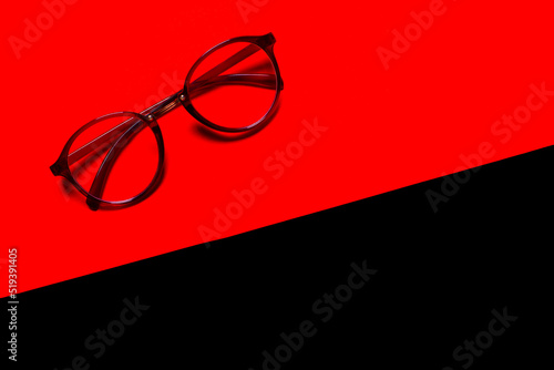 glasses isolated on red and black background