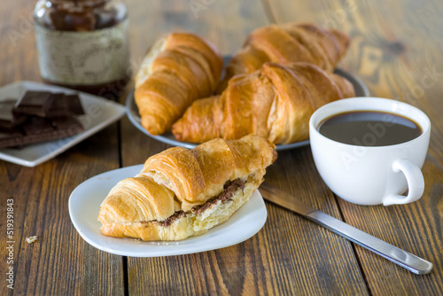 croissants with chocolate and a cup of coffee