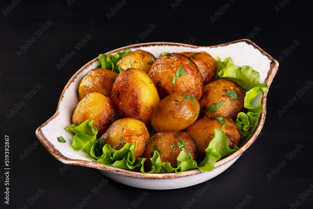 delicious baked potatoes on a dark background