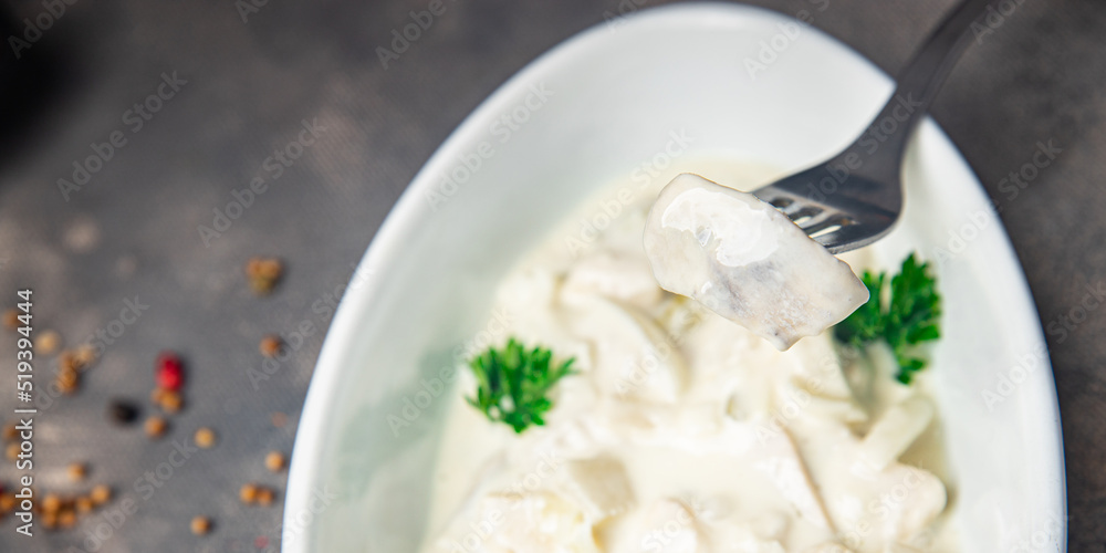 herring sour cream white sauce fresh healthy meal food snack on the table copy space food background herring sour cream white sauce fresh healthy meal food snack on the table copy space food background