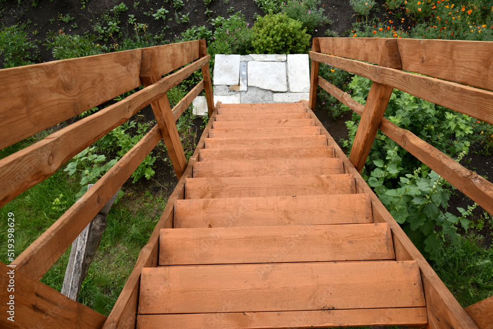 View down the flight of wooden stairs in summer View down the flight of wooden stairs in summer