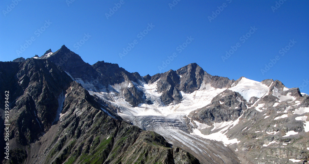 View to Mount Elbrus covered with snow, the highest mountain in Europe, the Caucasus, Kabardino-Balkaria, blue sky and snow covered rocks View to Mount Elbrus covered with snow, the highest mountain in Europe, the Caucasus, Kabardino-Balkaria, blue sky and snow covered rocks