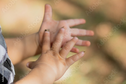 Cute baby girl hands. Aesthetic baby. Child development.