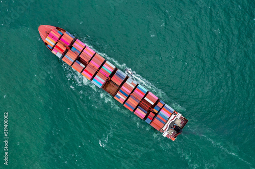 aerial top view container ship carrying cargo container import export internatioonal and worldwide, business and industry goods logistic transportation by container ship in open sea,