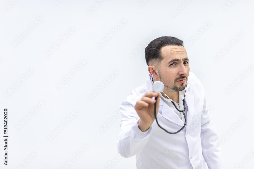 Close up photo of male mature doctor posing at camera with a stethoscope. Close up photo of male mature doctor posing at camera with a stethoscope.