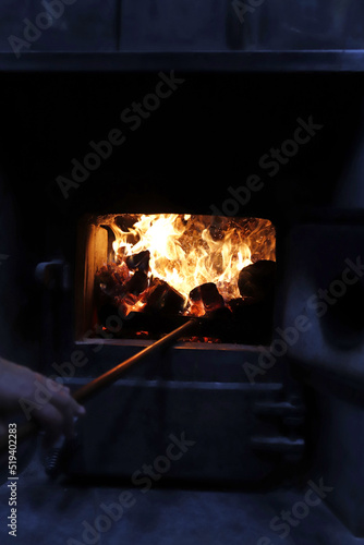 llamas en horno de leña para elaboración de pan photo