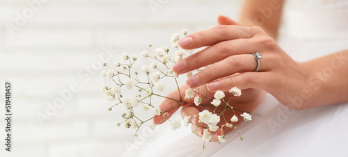 Young bride wearing beautiful engagement ring, closeup view with space for text. Banner design